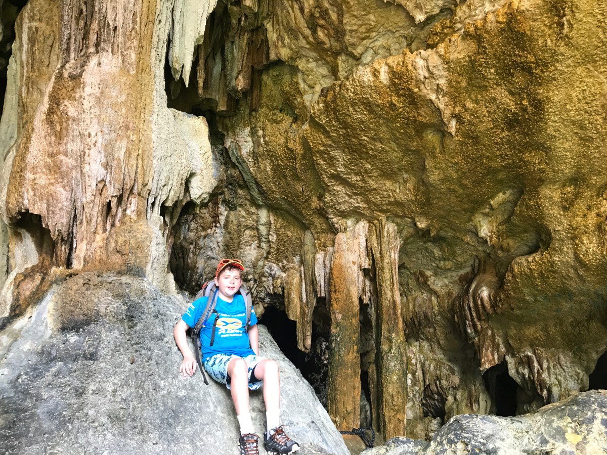 boy in a cave in Niue