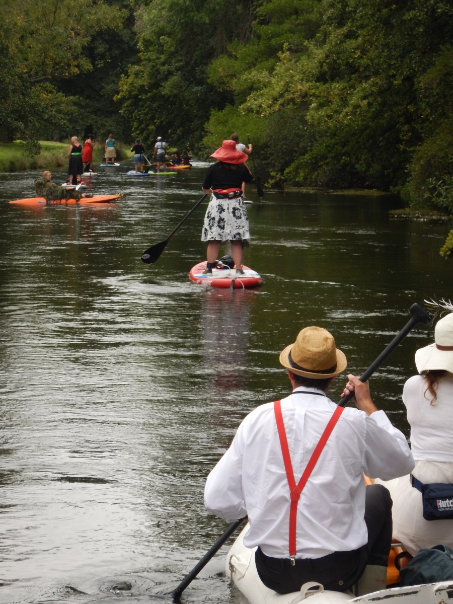 Friends paddling down the Avon on paddle boards
