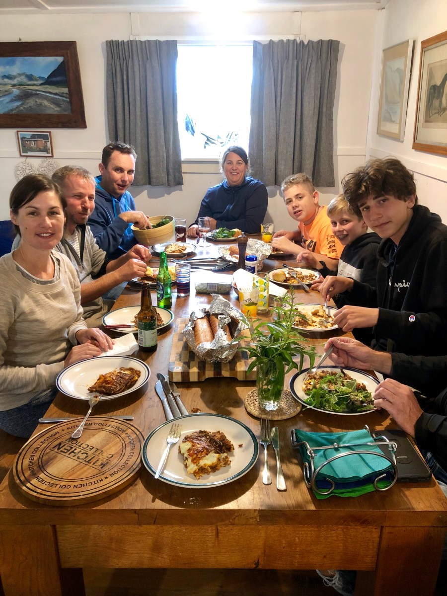 group of friends enjoying dinner on Kaikoura Coast Track