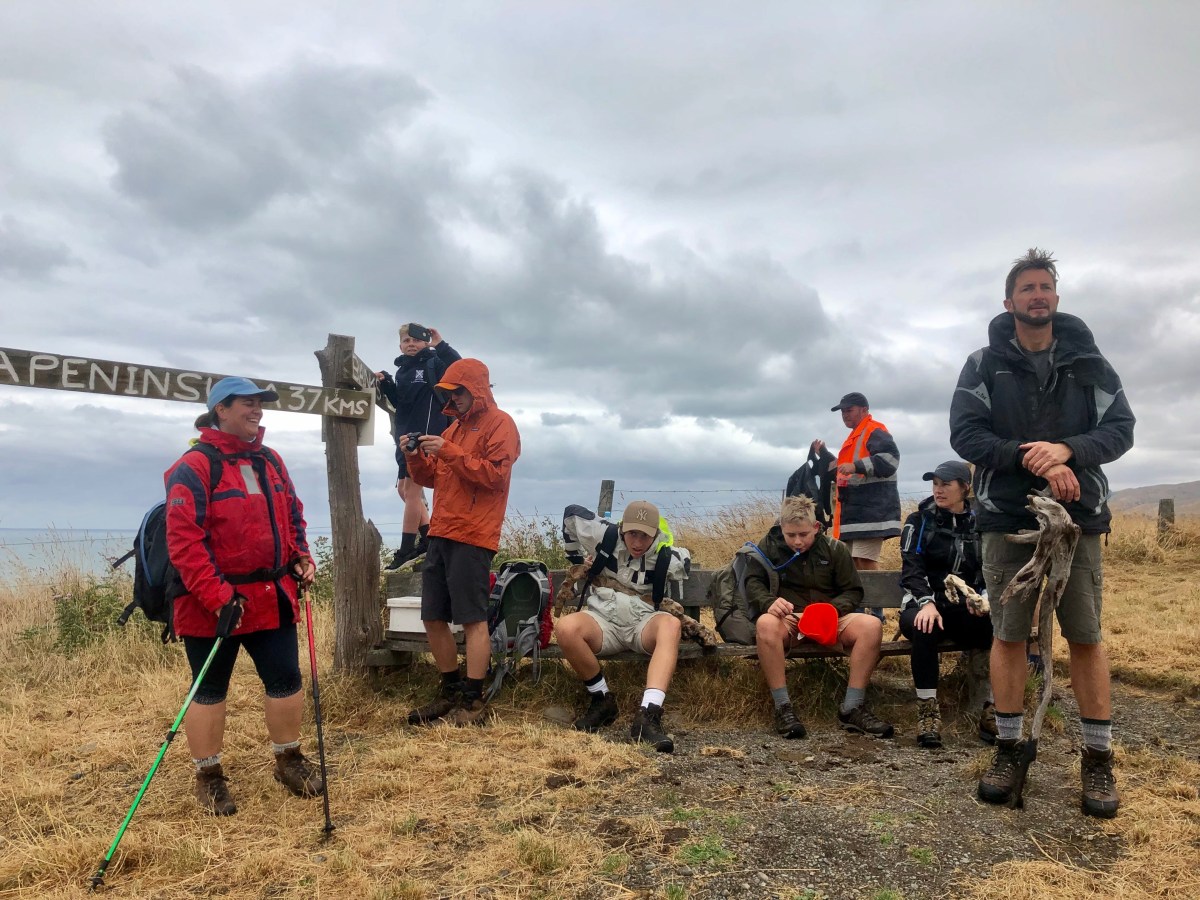 Kaikoura Coast Track lookout with group of friends resting