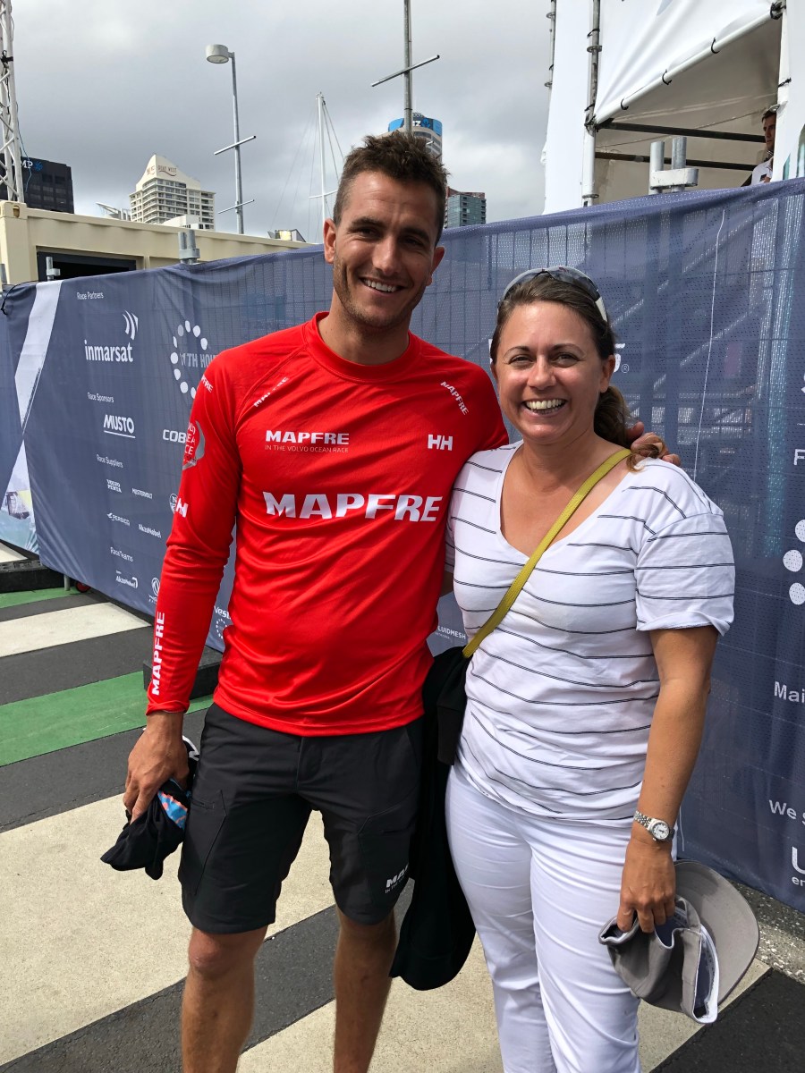 Viki Moore standing with Blair Tuke sailors